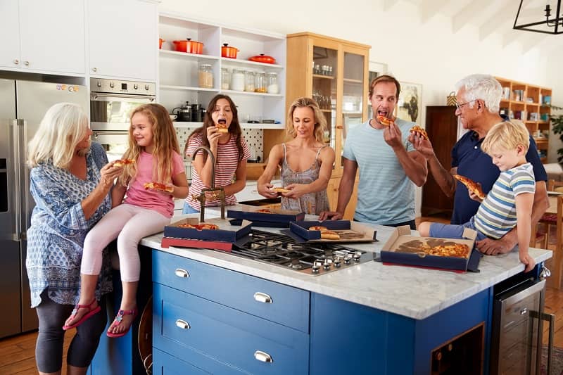 family enjoying in kitchen island