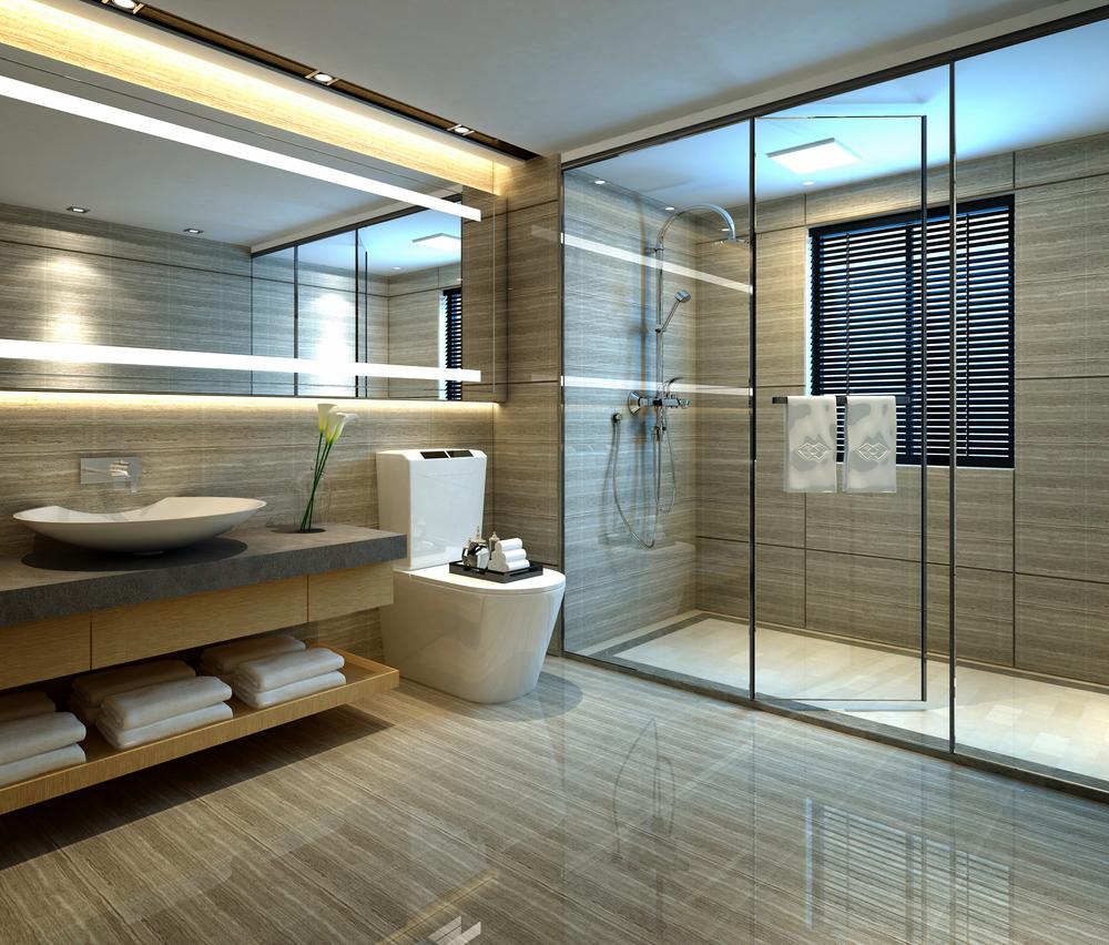 Modern bathroom showcasing kitchen and bath design with a glass-enclosed shower, floating vanity, elegant tile finishes, and contemporary lighting.
